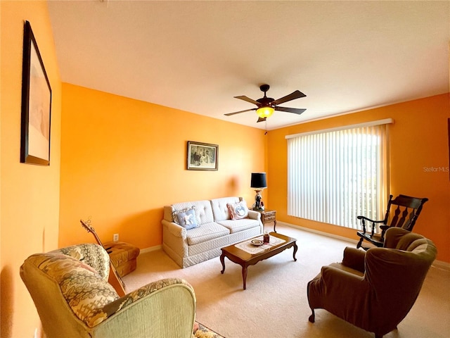 carpeted living room featuring ceiling fan