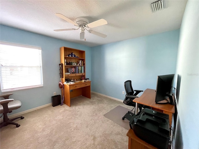 office featuring ceiling fan and light colored carpet