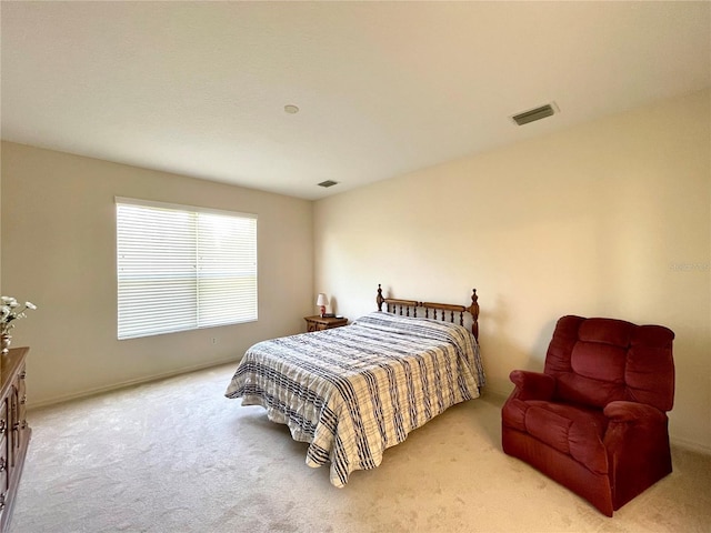 bedroom featuring light carpet