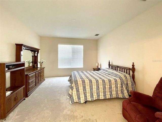 bedroom featuring light carpet