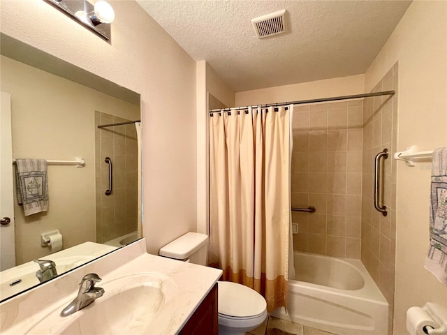 full bathroom with vanity, shower / tub combo, a textured ceiling, and toilet