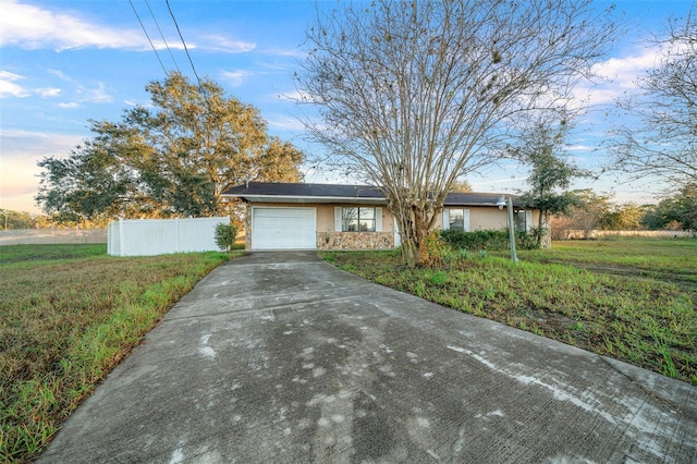 single story home featuring a garage