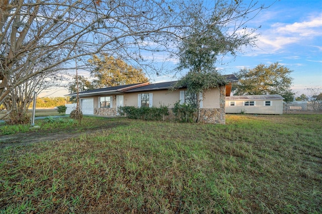 exterior space with a lawn and a garage