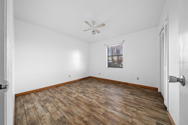 unfurnished bedroom featuring hardwood / wood-style floors and ceiling fan