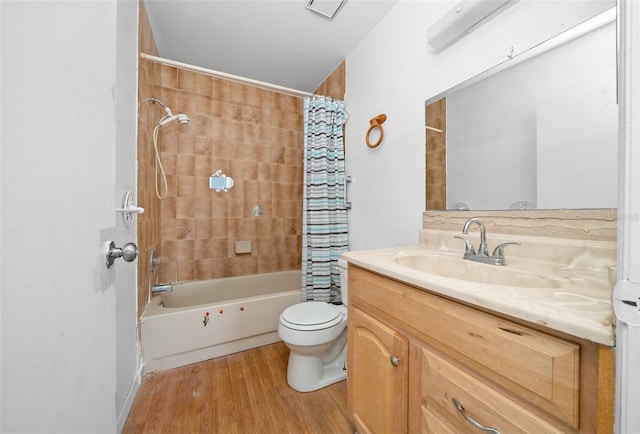 full bathroom with vanity, toilet, wood-type flooring, and shower / bath combo