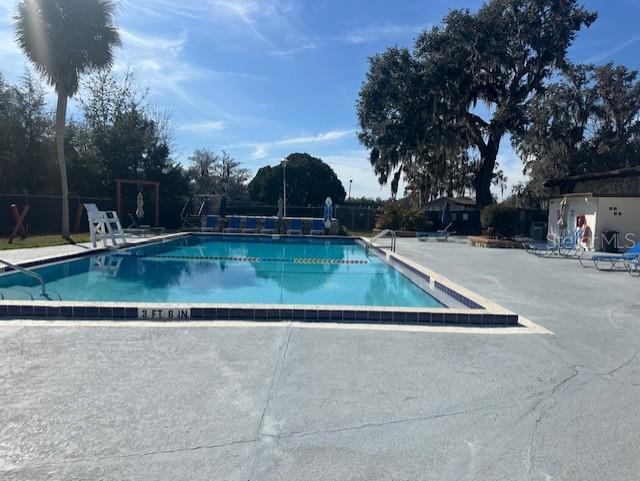 view of pool featuring a patio