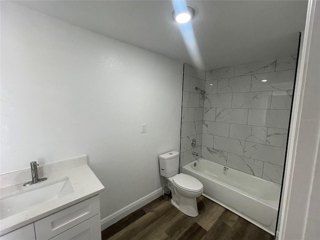 383 S Rooks Ave, Inverness, FL 34453 - bathroom featuring toilet, shower / washtub combination, wood finished floors, baseboards, and vanity