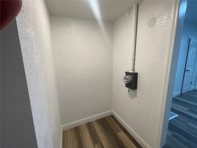 383 S Rooks Ave, Inverness, FL 34453 - details featuring a textured wall, electric meter, baseboards, and wood finished floors