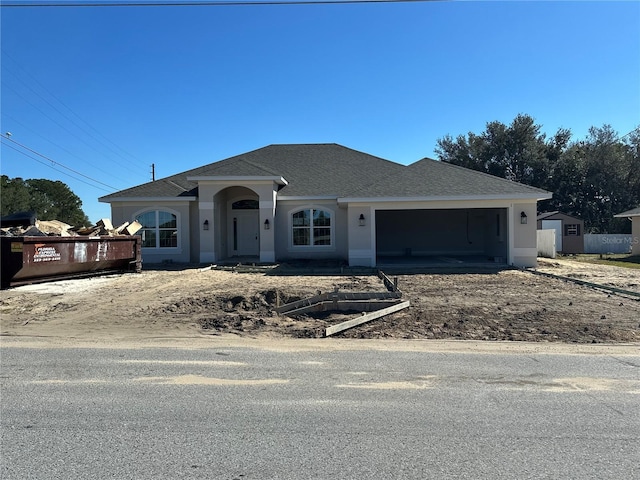 view of front of property with a garage