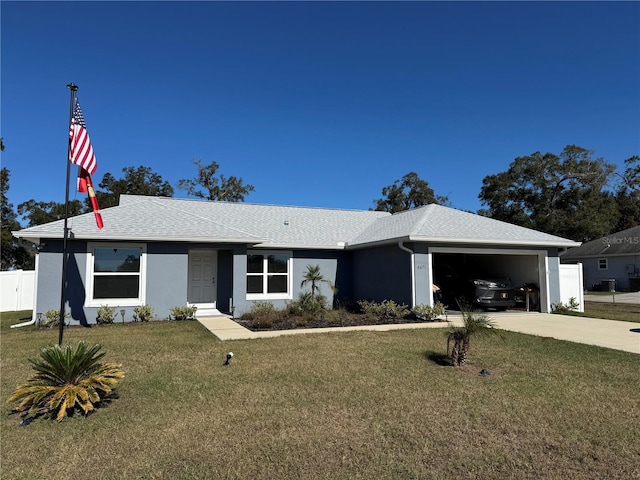 ranch-style house with a garage and a front lawn