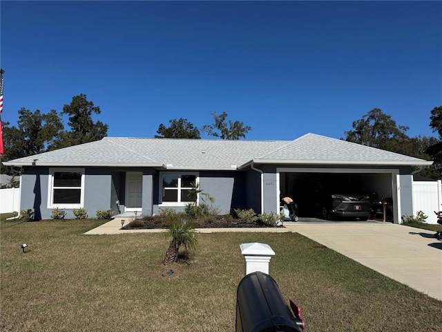 ranch-style house with a front yard and a garage