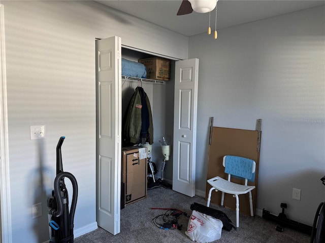 bedroom with carpet, ceiling fan, and a closet