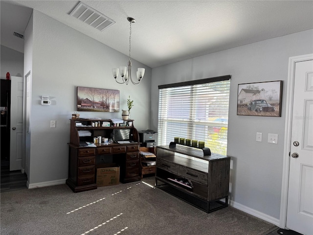 office area featuring dark colored carpet, an inviting chandelier, and vaulted ceiling