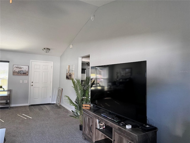 carpeted living room with lofted ceiling