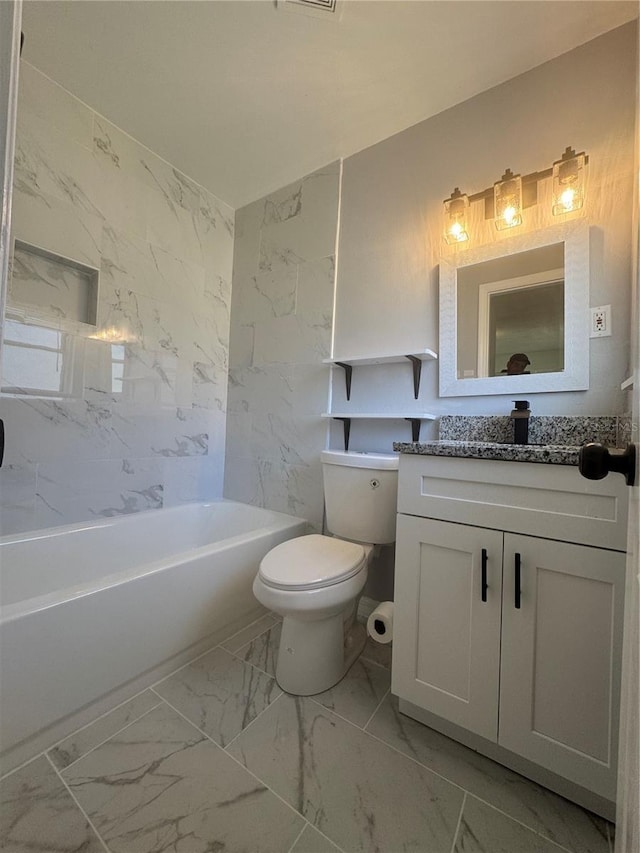 bathroom with marble finish floor, vanity, and toilet