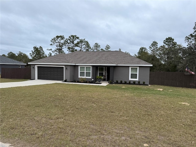 single story home featuring a garage and a front yard