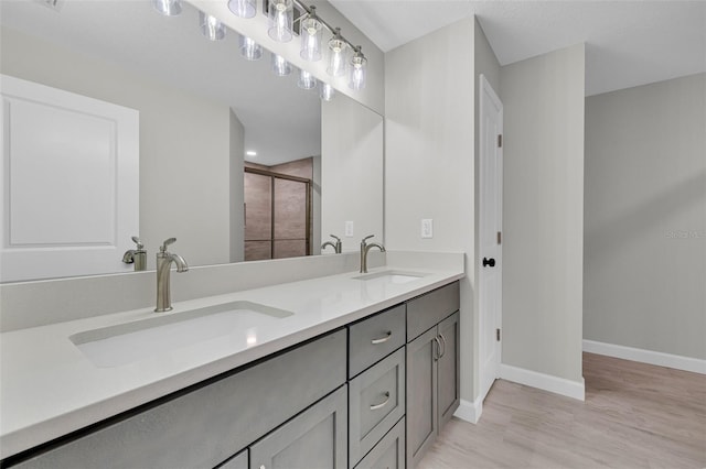 bathroom featuring vanity and hardwood / wood-style flooring