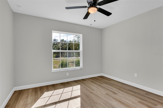 empty room with light hardwood / wood-style flooring and ceiling fan