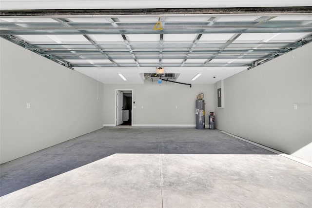 garage featuring electric panel and water heater