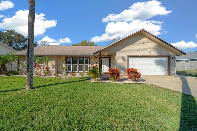 single story home with a garage and a front yard