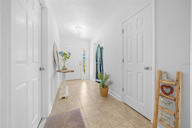 entryway with light tile patterned floors