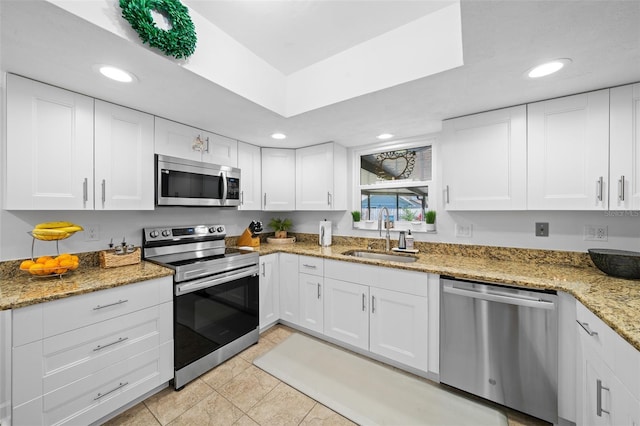 kitchen featuring white cabinetry, sink, and stainless steel appliances