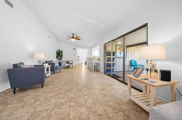 interior space with ceiling fan and vaulted ceiling with beams