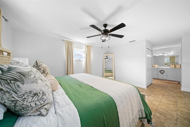 bedroom with connected bathroom and ceiling fan