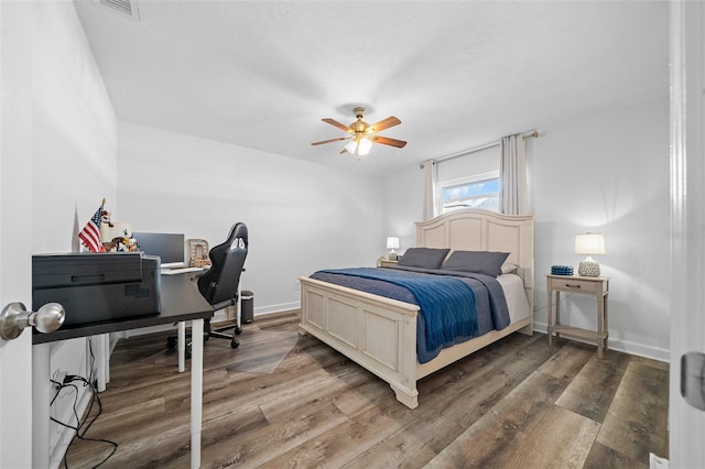 bedroom featuring hardwood / wood-style flooring and ceiling fan