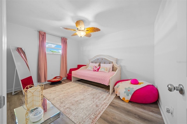 bedroom featuring ceiling fan and wood-type flooring