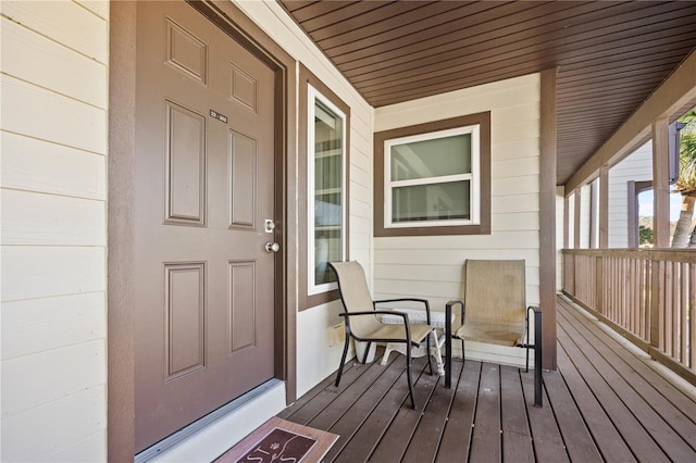 entrance to property featuring covered porch