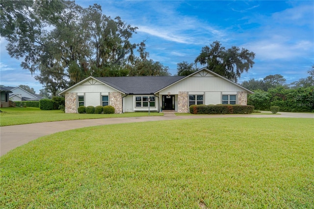 ranch-style house with a front lawn