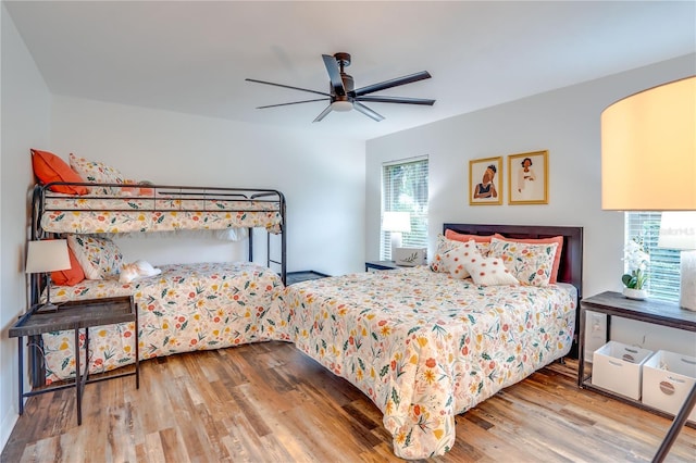 bedroom featuring hardwood / wood-style flooring and ceiling fan