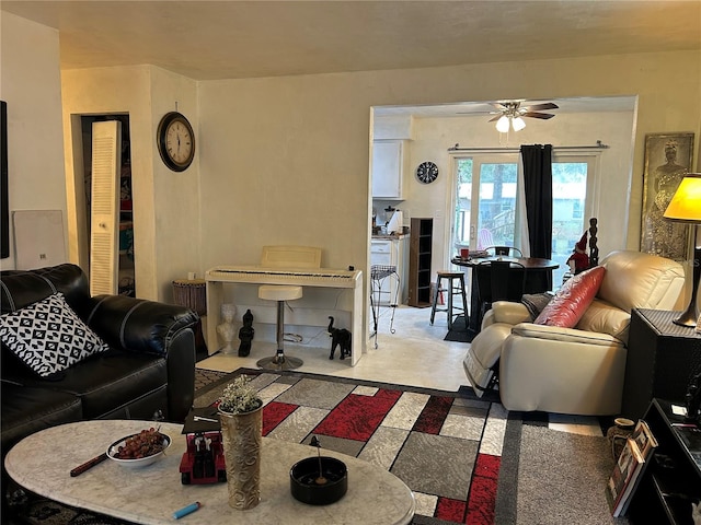 living area with a ceiling fan