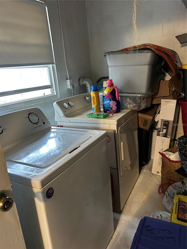 laundry area featuring laundry area and washing machine and clothes dryer