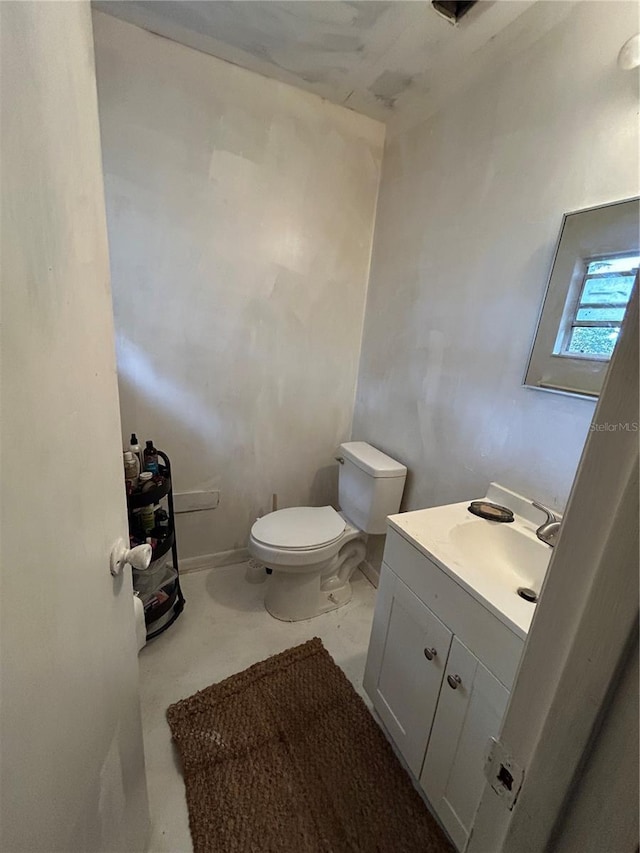 half bath with vanity and toilet