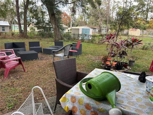 view of yard with a patio area, a fenced backyard, and outdoor lounge area