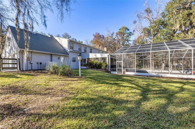 view of yard with glass enclosure