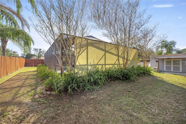 view of yard featuring glass enclosure