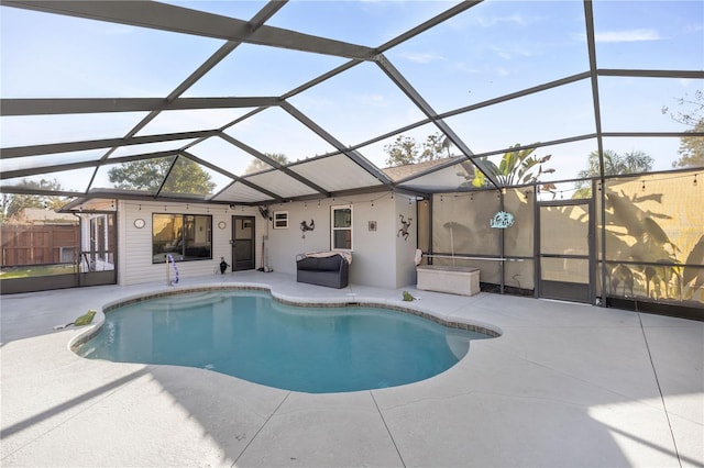 view of pool with a patio area and a lanai