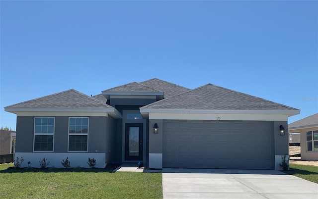 320 W Rexford Dr, Beverly Hills, FL 34465 - view of front facade with stucco siding, an attached garage, and roof with shingles