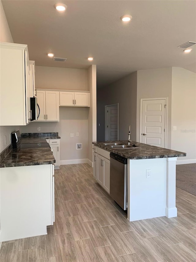 320 W Rexford Dr, Beverly Hills, FL 34465 - kitchen with a sink, baseboards, visible vents, white cabinetry, and appliances with stainless steel finishes