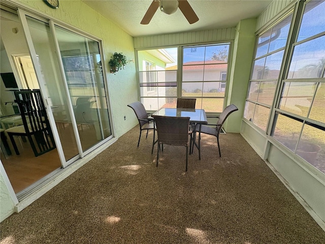 sunroom featuring ceiling fan