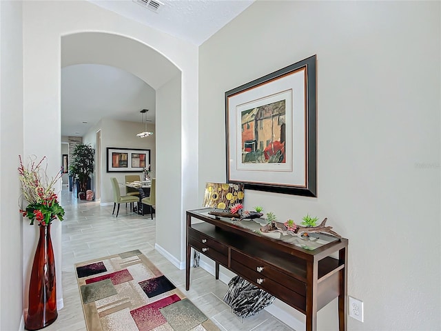 corridor featuring light hardwood / wood-style flooring