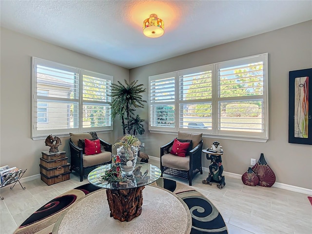 sitting room with light tile patterned flooring