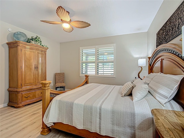 bedroom with ceiling fan and light hardwood / wood-style flooring