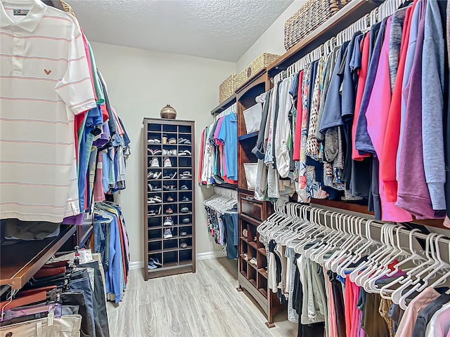 walk in closet featuring hardwood / wood-style floors