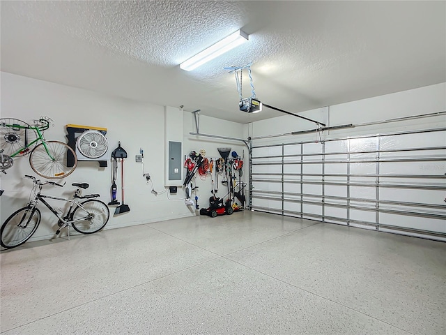 garage featuring a garage door opener and electric panel