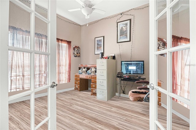 office area with french doors, hardwood / wood-style flooring, and ceiling fan