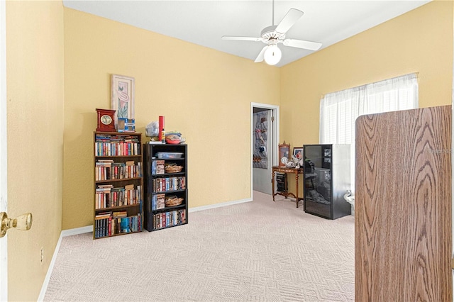 miscellaneous room with ceiling fan and light colored carpet